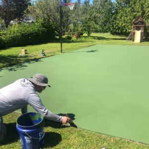 Green Acrylic Tennis Court being painted